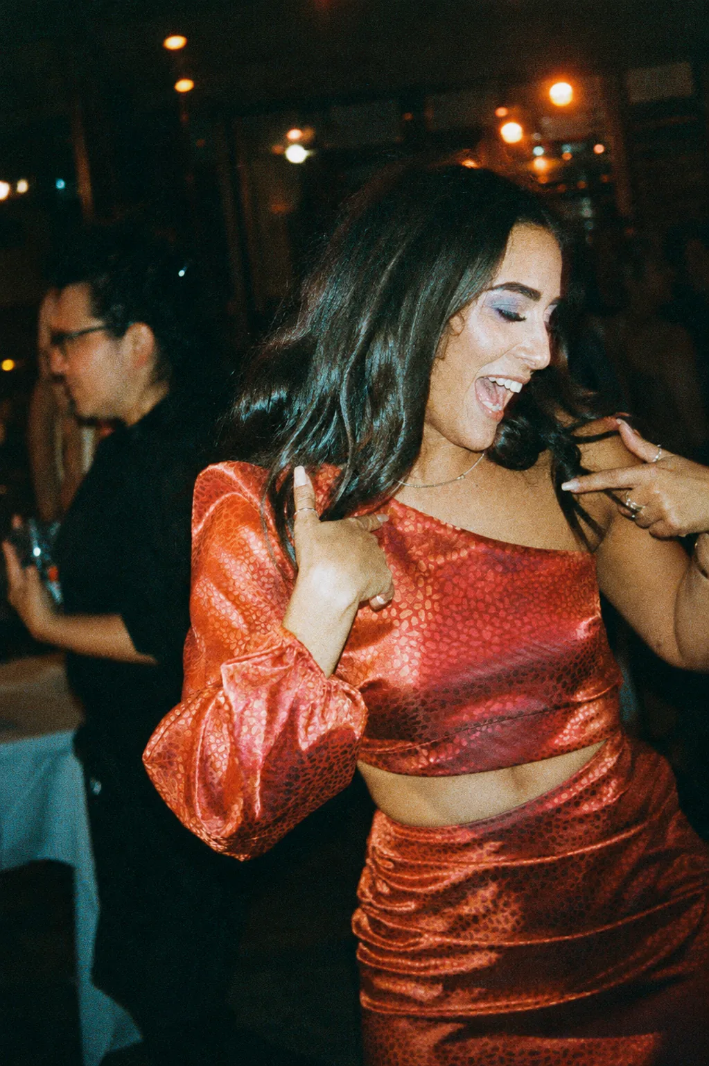 After: CineStill 800T night disposable-camera look with halation and direct flash